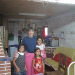 Vanessa Rubingh visiting in the home of some of the kids from the Santa Isabel VBS